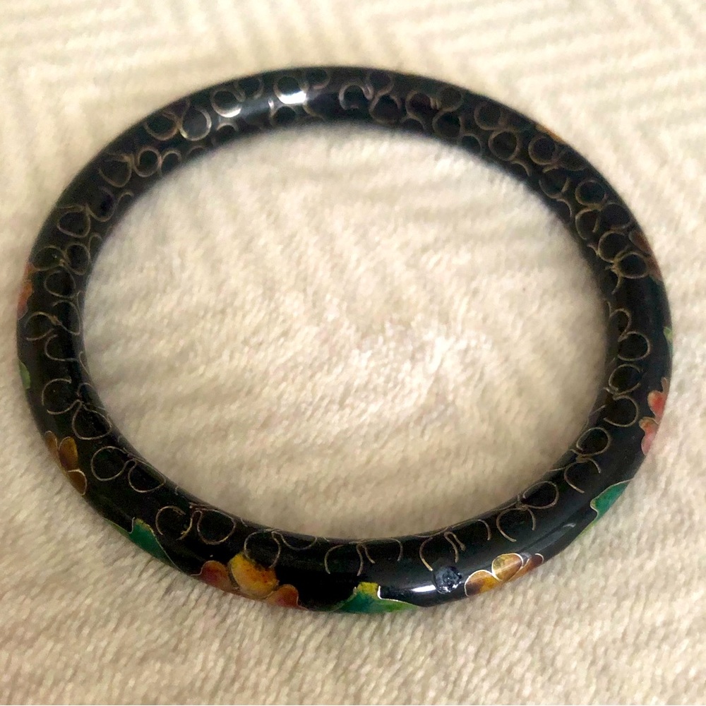 Black ceramic look bangle, with green, peach, red, gold flowers